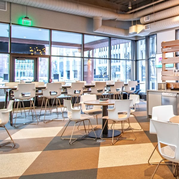 Rubber cork floor installed in a coffee shop alternating between tile colors
